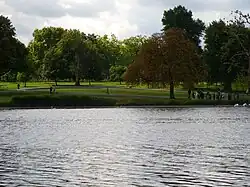 View south across the Serpentine to the Diana Memorial Fountain on the south bank.