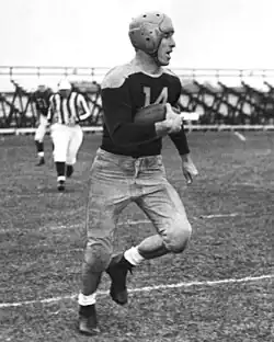 Don Hutson running with a football on the field