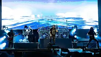 Dream Theater performing in 2025. (L–R): John Myung, Jordan Rudess, James LaBrie, Mike Portnoy, and John Petrucci.