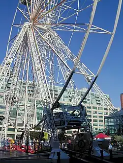 Four-car 30&nbsp;m tall drive-in Ferris wheel at Harbourfront, Toronto, Canada, in 2004[187]