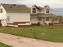 EF1 damage example-- A majority of the house's roof was blown away, some siding was torn away, and the roof's shingles were blown off or loosened.