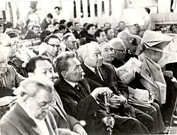 Bauyrzhan Momyshuly (holding a cane) next to Alkey Margulan and Mekemtas Myrzakhmetuly (on the right side, next to Momyshuly) at the Congress of the Writers' Union of Kazakhstan