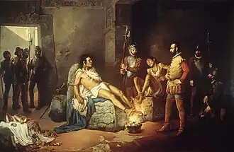 Depicted is the 1892 oil-on-canvas painting "El suplicio de Cuauhtémoc" by artist Leander Izaguirre, Spanish for "The Torture of Cuauhtémoc", which depicts a non-contemporary artistic interpretation of Cortés' torture of the Mexica tlatoani Cuauhtémoc. In the painting he and another compatriot are depicted with their bodies bound to engraved pieces of stone, and their feet chained to be in close contact with a raging flame coming off of a cauldron of charcoal. Cuauhtémoc, to the left, is depicted stoically, despite his feet being the closest to the fire, showing little reaction, while his compatriot is shown cowering in fear, having jerked his feet back from the fire. The latter looks up at a guard to the center-right background, who looks on in disdain, while in the foreground center-right, Hernán Cortés looks leftward at Cuauhtémoc rather neutrally. Cuauhtémoc's gaze is focused on his compatriot. There are various other Spanish dignitaries and guards in the background.