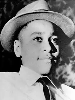Black-and-white head shot of Till facing right, wearing a dress shirt and necktie