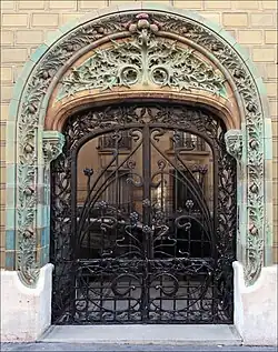 French Art Nouveau&nbsp;– Entrance decorated with glazed tiles of the Les Chardons Building (Rue Eugène-Manuel no. 2), Paris, 1903, by Charles Klein[66]