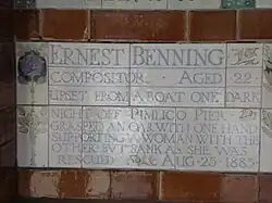 A tablet formed of five tiles of varying sizes, bordered by yellow and blue flowers in an art nouveau style