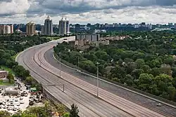 An empty freeway in the middle of a city.