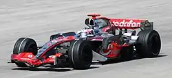 Alonso driving a silver McLaren MP4-22