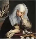 St. Catherine of Siena, wearing a white veil and black mantle, contemplates a crucifix intertwined with lilies and a skull.