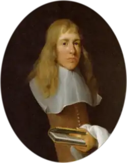 A man with long fair hair in 17th century dress
