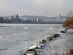 View upstream from the Donauinsel in Vienna, Austria, during an unusually cold winter (February 2006), as the river rarely freezes there[52]