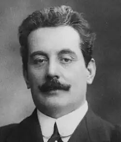 Black-and-white photograph of a young, moustachioed man.