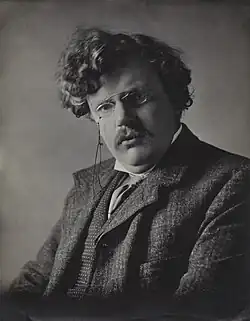 Black-and-white head shot photograph of Chesterton