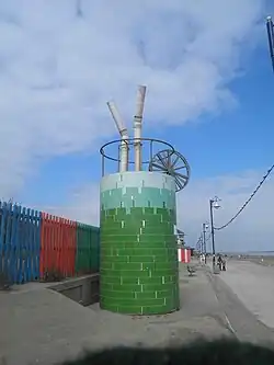 A sculpture of a gin and tonic on the Mablethorpe coastline.