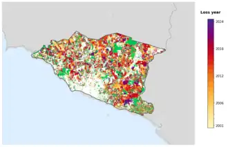 Map of Malacca showing tree-cover loss years, with forest remaining since 2000 in green and loss years shaded yellow through purple.