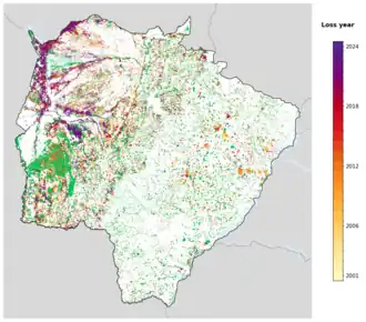 Map of Mato Grosso do Sul showing tree-cover loss years, with forest remaining since 2000 in green and loss years shaded yellow through purple.