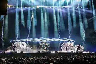 Gojira performing at Hellfest in France in 2022. (left to right) Christian Andreu, Mario Duplantier, Joe Duplantier, and Jean-Michel Labadie