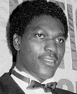 A man wearing a suit and a white shirt.