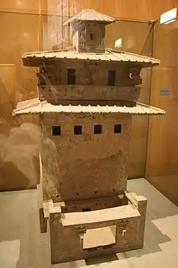 A Han pottery model of a granary tower with windows and balcony placed several stories above the first-floor courtyard; Zhang Heng (78–139&nbsp;AD) described the large imperial park in the suburbs of Chang'an as having tall towers where archers would shoot stringed arrows from the top in order to entertain the Western Han emperors.[410]