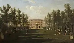 An oil painting showing a wide grassy avenue with trees on either side, leading to the brick south façade of Ham House, with an array of figures strolling through the gardens