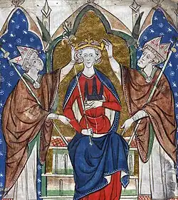 Henry seated on a throne flanked by bishops