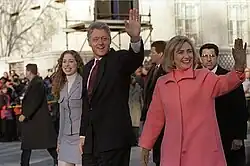 The Clinton family walking and greeting the crowds