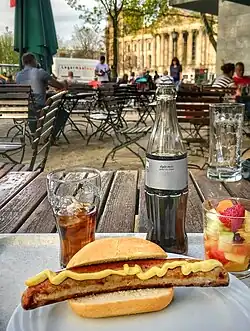 In Germany, the sausages from hot dogs are heated in a kettle of hot broth, but are also often grilled, then served in a crunchy bun. The German term for this grilled street food is "Bockwurst" or "Bratwurst im Brötchen".