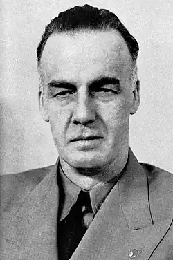 Black-and-white photo of a man wearing a suit