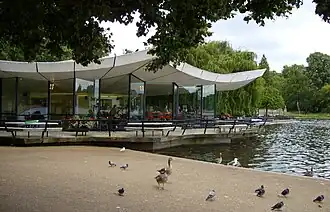 The modernist architecture of the Dell Restaurant, situated on the northern end of the dam, dominates the eastern end of the lake.
