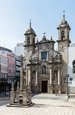 A cruceiro, or wayside cross, and San Xurxo church in A Coruña