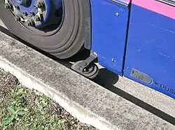 The kerb guide wheel of a bus in Ipswich, England