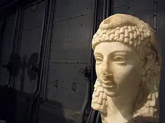 Possible sculpted head of Cleopatra VII wearing an Egyptian-style vulture headdress, discovered in Rome, either Roman or Hellenistic Egyptian art, Parian marble, 1st century BC, from the Capitoline Museums[442][443]