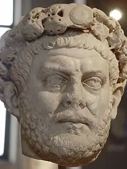 Statue of a male head wearing a diadem