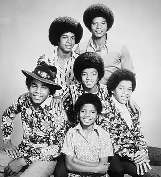 The six Jackson brothers in 1974 Clockwise from bottom left: Tito, Jermaine, Jackie, Marlon, Randy, and Michael (center)