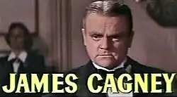 face shot of Cagney with short hair parted slightly off center