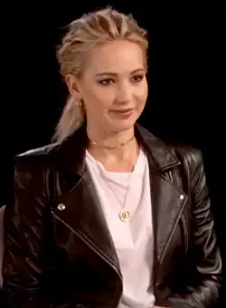 Lawrence glancing to her right and smiling