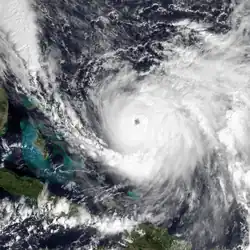 An intense hurricane with a clear circular eye and curved rainbands on its eastern flank