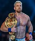 Joe Hendry with the current design of the belt, introduced in 2024, which reverted back to TNA branding.