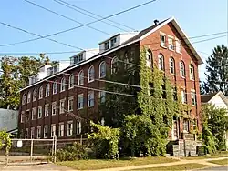 Built in 1798 as Johnstown Academy, this building was converted into a glove-making factory in 1886.