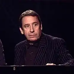 Jools Holland (born 1958) is an English musician, bandleader, and television presenter, best known as the host of Later... with Jools Holland. He has been based in the Greenwich area, including Westcombe Park near Greenwich Park, where he has maintained a recording studio and worked extensively with British and international musicians.