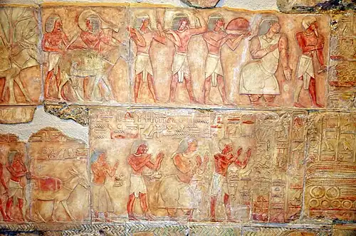 Puntites including their Queen, bearing tributes, represented in the classic reddish-brown colouring as Egyptians[243]