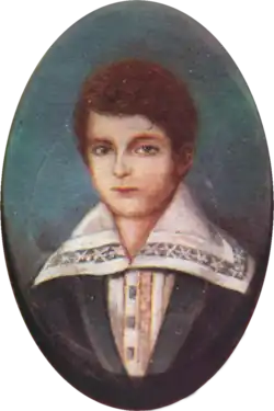 Half-length portrait of a boy with light hair and wearing a jacket over a shirt with an enormous, embroidered collar.