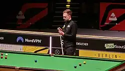 Judd Trump, preparing for a shot