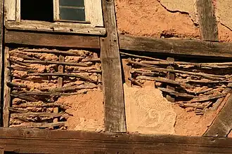 The wattle and daub was covered with a decorated layer of plaster.