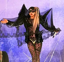 Lady Gaga performing with a mic in her hand