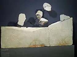 Photograph of cult workers in a relief