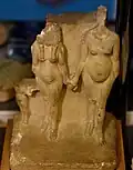 Limestone statuette of Akhenaten and Nefertiti, or Amenhotep III and Tiye,[72] and a princess. Reign of Akhenaten. From Amarna, Egypt. The Petrie Museum of Egyptian Archaeology, London