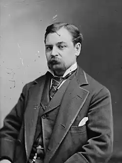 Man with mustache in formal attire