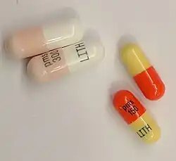 Four lithium carbonate capsules.