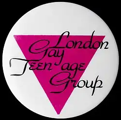 A pink and white badge with the text "London Gay Teenage Group".